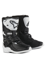 Alpinestars Kids Tech 3S Boots, Motocross Boots, Black and White, featuring white TPU shin plates with black Alpinestars logos, adjustable buckle and hook-and-loop closures, durable rubber outsoles for youth off-road protection.