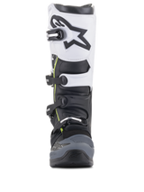Alpinestars Tech 5 Boots, Motocross Boots, Black Dark Gray and White, front-facing view featuring a multi-buckle closure system, white upper panel with black Astars logo, dark gray reinforced toe, and subtle yellow accents
