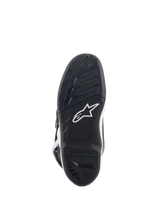 Alpinestars Youth Tech 7S Boots, Bottom Sole View, Black rubber with textured grip pattern and white Alpinestars logo, durable compound construction for youth motocross.