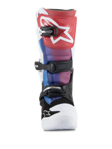 Alpinestars Youth Tech 7S Boots, Motocross Boots, White Black Rainbow, front view featuring a red shin plate with white star logo, blue and purple panels, black buckle system, and white toe, durable off-road racing footwear