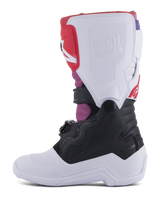 Alpinestars Youth Tech 7S Boots, Motocross Boots, White Black Rainbow, medial side view featuring white shin plate with embossed Tech Series logo, black lower section, and vibrant pink and red accents, durable protective gear for youth off-road riding