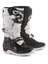 Alpinestars Youth Tech 7S Boots, Motocross Boots, Black and White, featuring adjustable buckle closure system, TPU shin guard and pivot system, durable construction with thick patterned soles for off-road riding