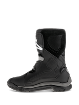 Alpinestars Belize Drystar® Boots, Black motorcycle boots, side profile view showing leather construction with TPU protection panels, suede texture, and a rugged vulcanized rubber outsole for adventure touring