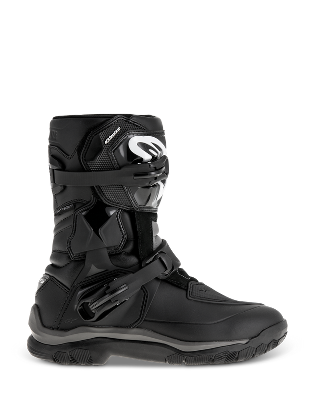 Alpinestars Belize Drystar Boots, Black Adventure Touring Boots, featuring a mid-height design with dual adjustable buckles, rugged textured outsole for grip, reinforced protection panels, white logo on the shin, waterproof motorcycle footwear