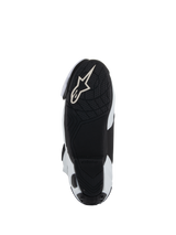 Sole of Alpinestars Supertech R Vented Boots, Black lightweight rubber outsole with textured tread for grip on pegs, featuring white Alpinestars Astar logo, White and Black colorway