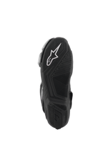 Alpinestars SMX-6 V3 Boots, Black, bottom sole view featuring a textured rubber outsole for grip, white Alpinestars logo on the heel, embossed branding, designed for track and street performance riding.