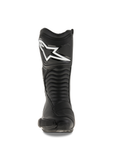 Alpinestars SMX S Boots, Black motorcycle boots, front-facing view showing the large white Alpinestars logo on the shin plate, accordion-style flex panels, and durable microfiber construction with protective PU shields