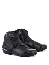 Alpinestars SMX-1 R V2 Boots, Black Low-Cut Motorcycle Riding Boots, featuring white logos with red accents, Velcro strap and side zipper closure, reinforced TPU protection, sleek aerodynamic design for road and sport riding