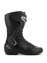 Alpinestars SMX-6 V3 Drystar Boots, Black performance motorcycle riding boots shown from a side profile, featuring white logo accents, TPU lateral ankle brace, reinforced shin plate, and flexible mesh panels.