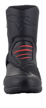 Alpinestars Ridge V2 Waterproof Boot, Black motorcycle touring boot, front view featuring red accordion flex panels on the instep, embossed logo on the shin, and durable microfiber construction for adventure and road riding.