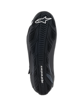 Alpinestars Faster-4 Shoes, Black, bottom view of the rubber outsole featuring textured grip patterns, white Alpinestars logo on the forefoot and branding on the heel, performance motorcycle riding shoe