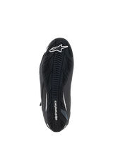 Alpinestars Faster-4 Shoes, Motorcycle Riding Shoes, Black and White, textured rubber sole view, featuring white Alpinestars star logo on the toe and wordmark on the arch, grip-focused outsole for road performance