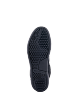 Alpinestars Chrome Air Shoe, Black, bottom view showing the outsole with a detailed hexagonal traction pattern, embossed Alpinestars logo and branding, durable rubber sole for urban motorcycle riding
