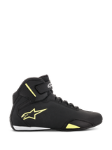 Alpinestars Sektor Shoes, Motorcycle Riding Shoes, Black and Yellow Fluorescent, side view showing yellow star logo, ankle strap with branding, and white heel accent on a sleek microfiber upper.