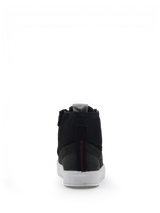 Alpinestars Stated Shoes, men's black urban riding sneakers in nubuck and canvas, rear view with white soles.