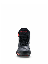 Alpinestars Faster-4 Drystar® Shoes, Black with Rio Red and Red Fluo accents, front view showing the lace-up closure and hook-and-loop ankle strap with red branding, waterproof motorcycle riding footwear with a reinforced toe and sporty design