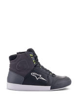 Alpinestars Chrome Drystar Shoes, urban motorcycle riding sneakers in Black, Dark Gray, and Yellow Fluo, featuring premium leather and suede panels, white sole, neon yellow laces, and signature star logo.