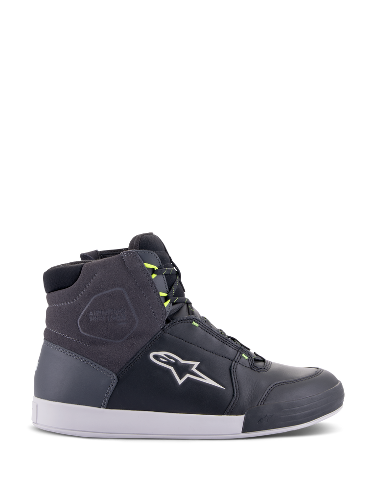 Alpinestars Chrome Drystar Shoes, urban motorcycle riding sneakers in Black, Dark Gray, and Yellow Fluo, featuring premium leather and suede panels, white sole, neon yellow laces, and signature star logo.