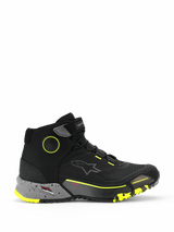Alpinestars CR-X Drystar Riding Shoes, high-top motorcycle urban sneakers, black with dark gray speckled midsole and yellow fluo accents, waterproof Drystar membrane, rugged textured sole, protective casual riding footwear
