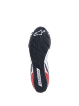 Alpinestars Tech-1 T V3 Shoes FIA, Auto Racing Shoes, White Black and Red, detailed view of the asymmetric tire-tread-inspired rubber sole, featuring the Alpinestars logo and wordmark, oil-resistant and water-repelling outsole design