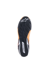 Alpinestars Tech-1 T V3 Shoes FIA, Orange Fluo Black White, bottom view showing the black rubber outsole with an asymmetric tread pattern, white Alpinestars logo on the toe and wordmark on the heel.