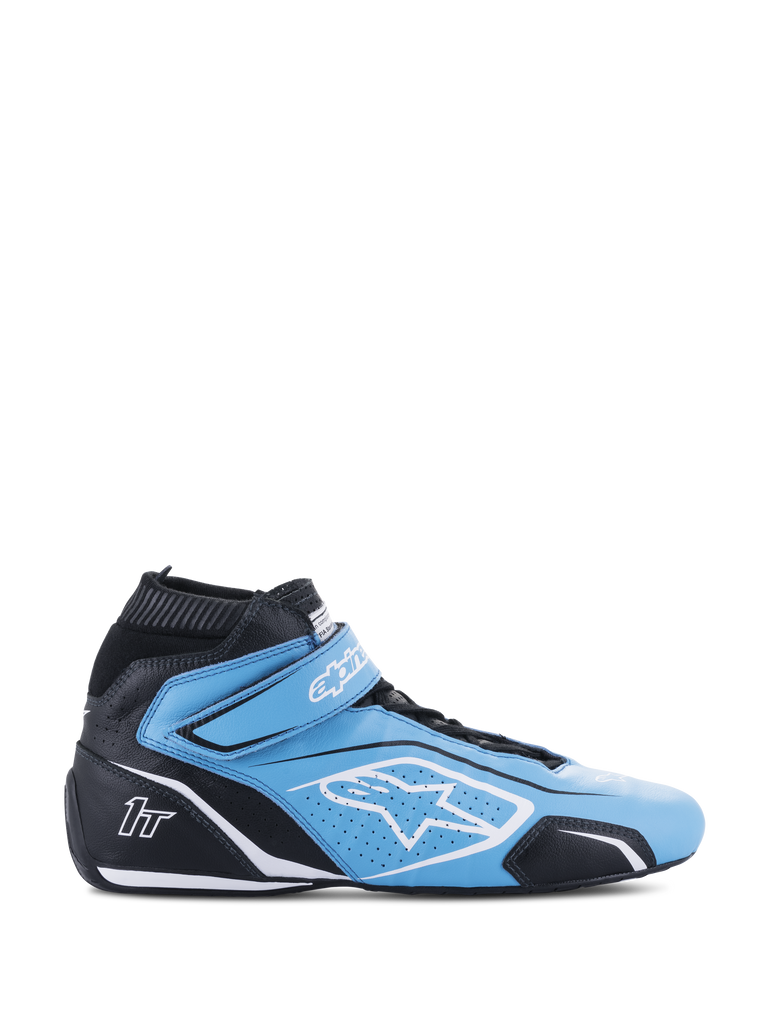 Alpinestars Tech-1 T V3 Shoes FIA, high-top auto racing shoe, light blue and black with white accents, side view featuring a Velcro strap, white star logo, perforated leather construction, and a thin performance outsole