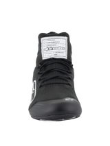 Alpinestars Supertech Shoes, Auto Racing Footwear, Black, front view showing the aramidic knitted upper, white FIA certification label on the tongue, and small white Astars logo on the toe, professional motorsport design