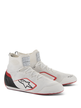 Alpinestars Supertech Shoes, Auto Racing Footwear, White Red and Black, featuring a fully knitted upper, black carbon fiber heel cup, and red accents on the sole and logo, professional motorsport shoes with FIA/SFI certification labels on the tongue.
