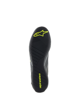 Alpinestars Supertech Shoes, Auto Racing Footwear, Cool Gray and Yellow Fluo, detailed view of the black rubber outsole with textured asymmetric tread and yellow Alpinestars logos for pedal grip and sensitivity.