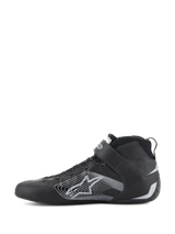 Alpinestars Tech-1 Z V3 Shoes FIA, Auto Racing Shoes, Black and Silver, side profile view, premium bovine leather upper with a large silver stylized star logo, velcro ankle strap, and sleek high-top design for professional motorsport performance.