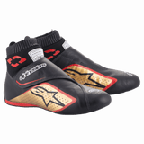 Alpinestars Supermono V2 Shoes FIA, Auto Racing Shoes, Black Gold and Red, ultra-lightweight leather construction, featuring a gold star logo with red outlines, sock-like elastic collar, and hook-and-loop strap closure
