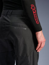 Alpinestars C-1 Air Pants, Black textile motorcycle pants, close-up view of the back pocket with a subtle grey Alpinestars logo, featuring breathable mesh panels and durable polyfabric, designed for urban riding comfort