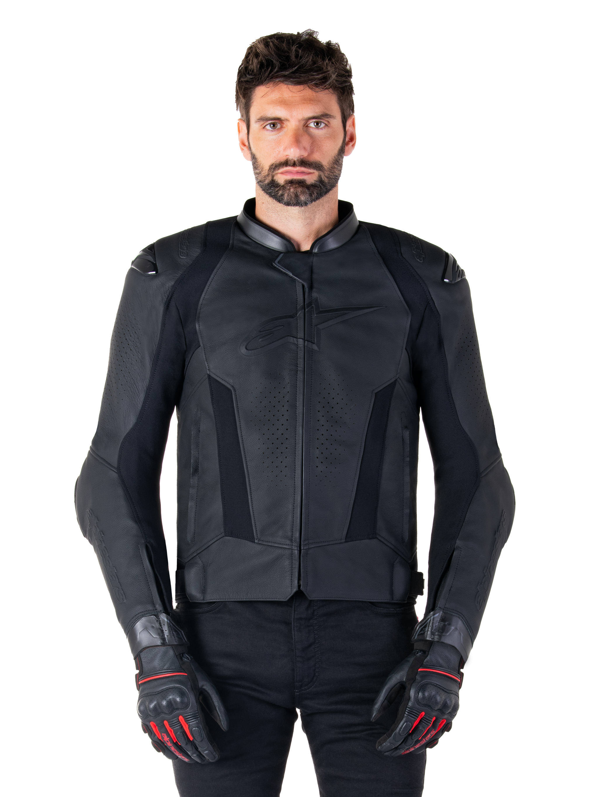 Alpinestars Missile V3 Leather Jacket, Black Motorcycle Racing Jacket, worn by model with matching black gloves and pants, featuring perforated leather for ventilation, external shoulder sliders, and sleek sport riding design