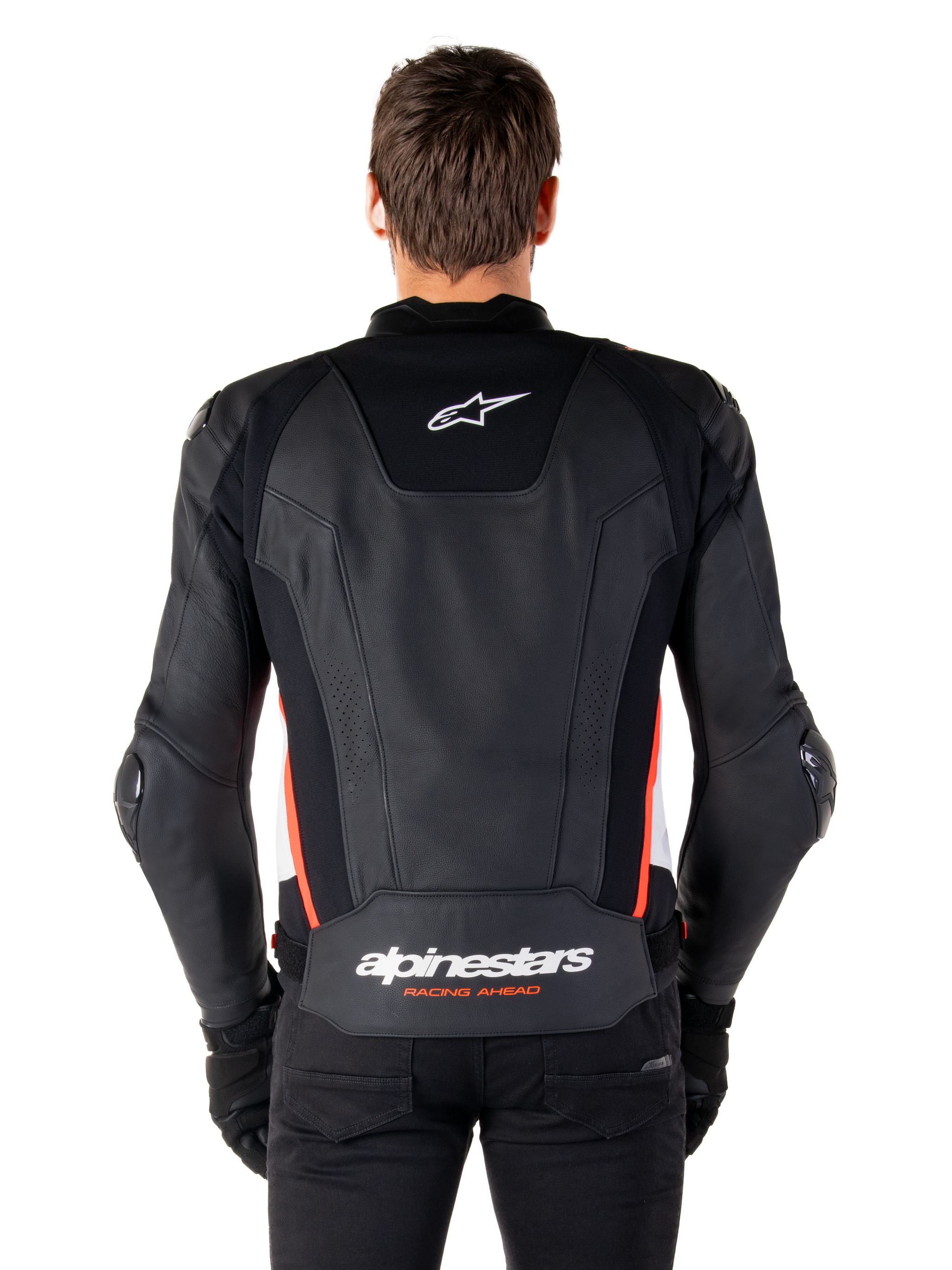 Alpinestars Missile V3 Leather Jacket, back view, premium black leather with red fluo and white accents, featuring a white star logo on the upper back and Alpinestars branding on the lower back, worn with black pants and gloves.
