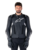 Alpinestars Missile V3 Airflow Leather Jacket, Black and White, motorcycle racing jacket with perforated leather ventilation panels, large white star logo on chest, worn with matching gloves, sporty protective design