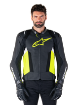 Alpinestars Missile V3 Airflow Leather Jacket, Racing Sport Motorcycle Jacket, Black Yellow Fluo and White, worn by a model with black riding gloves, featuring perforated leather on the chest, bold yellow fluo logo, and white branding on the sleeves