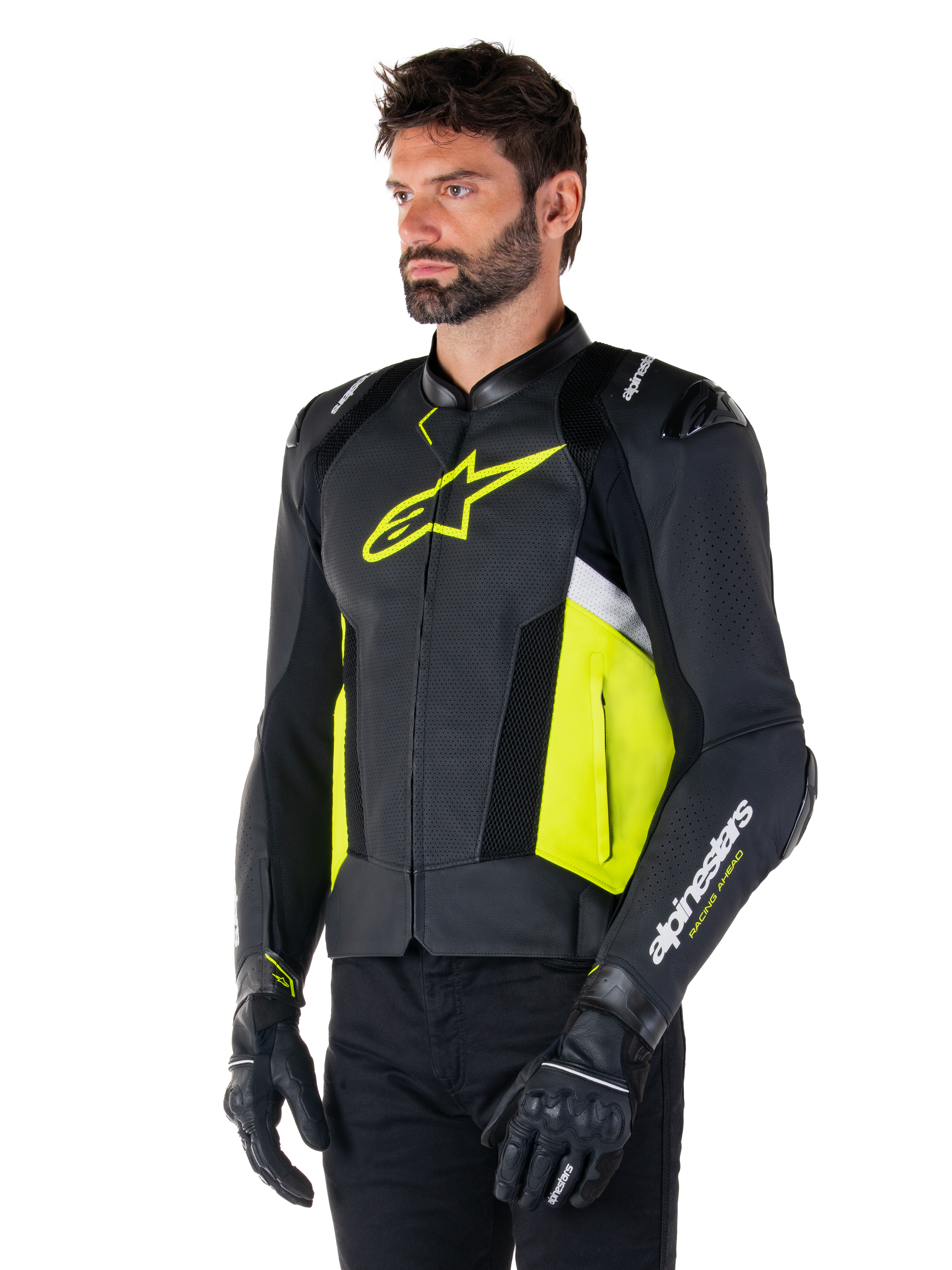 Male model wearing Alpinestars Missile V3 Airflow Leather Jacket, Black with Yellow Fluo and White accents, featuring perforated leather for maximum ventilation, bold yellow logo on the chest, paired with black gloves and pants, sport-style racing motorcycle gear