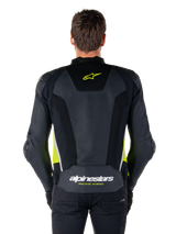 Alpinestars Missile V3 Airflow Leather Jacket, back view, black with fluo yellow and white accents, extensive perforated leather panels for cooling, Alpinestars branding on the upper and lower back, racing-inspired motorcycle sport jacket