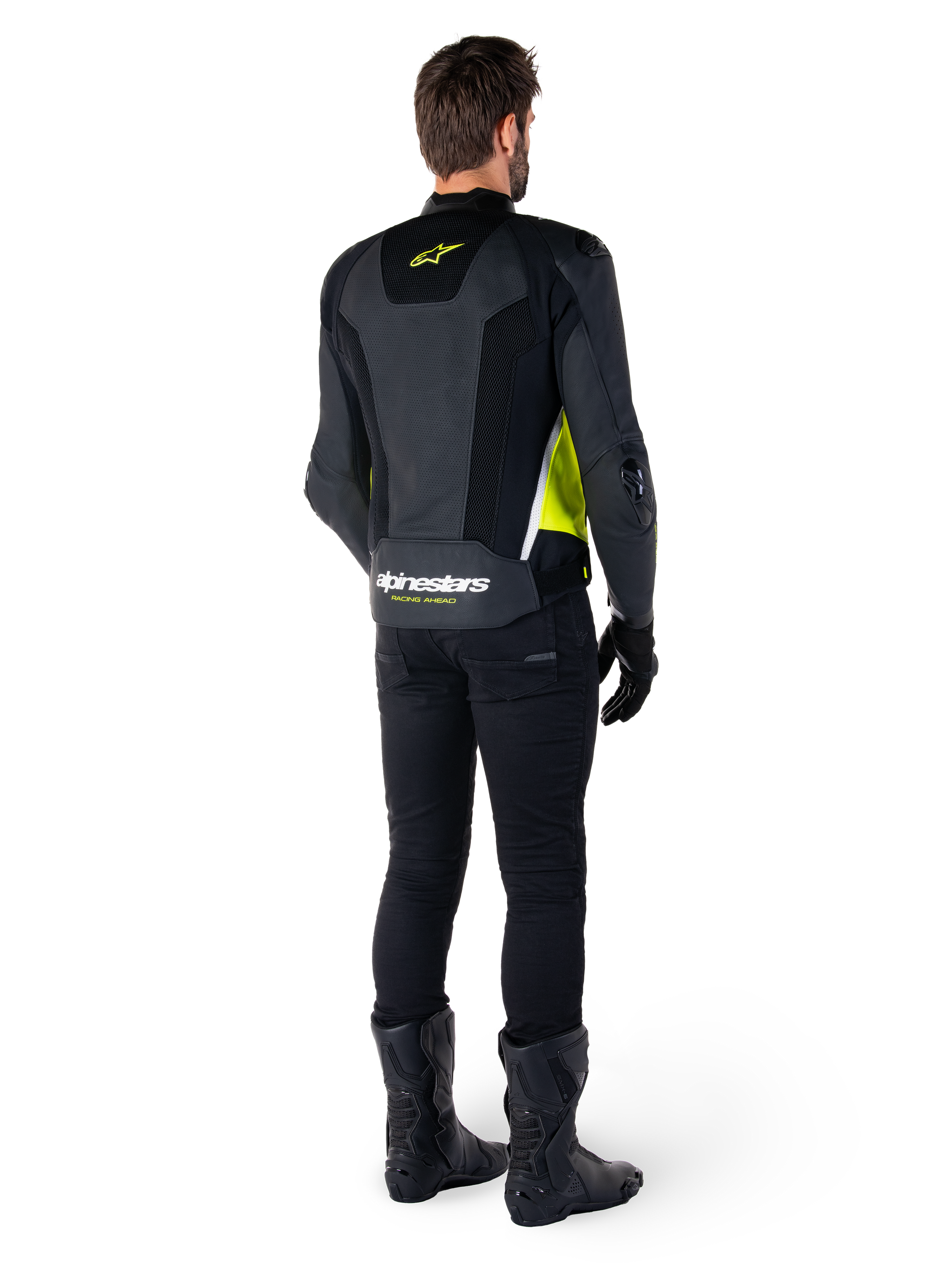 Alpinestars Missile V3 Airflow Leather Jacket, Black Yellow Fluo White, rear view on rider, featuring perforated leather back panels, yellow Alpinestars logo, and white accents, worn with black riding pants and boots