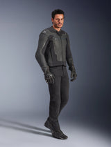 Man wearing Alpinestars GP Force V2 Leather Jacket in Black, paired with black pants and motorcycle gloves, full-body studio shot, sleek bovine leather construction with integrated shoulder and elbow protection, professional sport motorcycle road gear