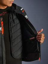 Alpinestars GP Force V2 Leather Jacket, Black and White, detailed view of the interior showing the detachable quilted thermal liner and waterproof inner pocket, worn over a black base layer, high-performance motorcycle riding gear