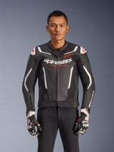 Alpinestars GP Force V2 Leather Jacket, Black and White with Red accents, Motorcycle Racing Jacket, premium leather construction with protective armor, Racing Ahead branding, worn with matching gloves