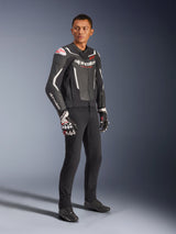 Alpinestars GP Force V2 Leather Jacket, Black and White, worn by male model with black riding pants and technical gloves, featuring red Alpinestars logos, sport-fit leather motorcycle jacket for road riding