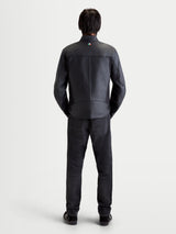 Alpinestars Maver-X Leather Jacket, men's urban contemporary motorcycle jacket in black, rear view on a model wearing matching dark jeans and shoes, showing premium leather construction and collar detail.