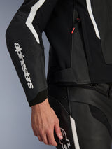 Alpinestars GP Force V2 Air Leather Jacket, Black and White, close-up profile view of the sleeve with white Alpinestars branding, perforated leather for enhanced airflow, and flexible stretch panels, sport riding jacket with premium leather construction