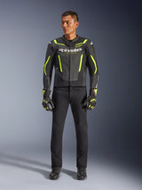 Alpinestars GP Force V2 Air Leather Jacket, Black and Yellow Fluo, perforated leather sport jacket with bold yellow accents and Alpinestars branding, worn with black pants and matching motorcycle gloves