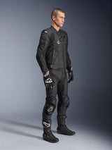 Alpinestars Missile V3 Leather Pants, paired with a matching black leather jacket, gloves, and boots, featuring knee sliders and a sleek racing fit, all-black motorcycle protective gear for track and road riding.