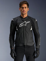 Alpinestars Dusk Airflow Leather Jacket, Black and White, leather motorcycle jacket worn by a model, featuring perforated leather panels for ventilation, a large white chest logo, and external shoulder sliders.
