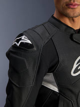 Alpinestars Dusk Airflow Leather Jacket, Black and White, close-up view of the shoulder and chest, featuring perforated leather for ventilation, DFS shoulder protection with white Alpinestars logo, and sporty design.