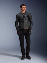 Alpinestars GP Plus R V4 Airflow Leather Jacket, Black, worn by a male model with matching black gloves and pants, featuring perforated leather panels, large tonal star logo on the chest, and sleek sport riding fit